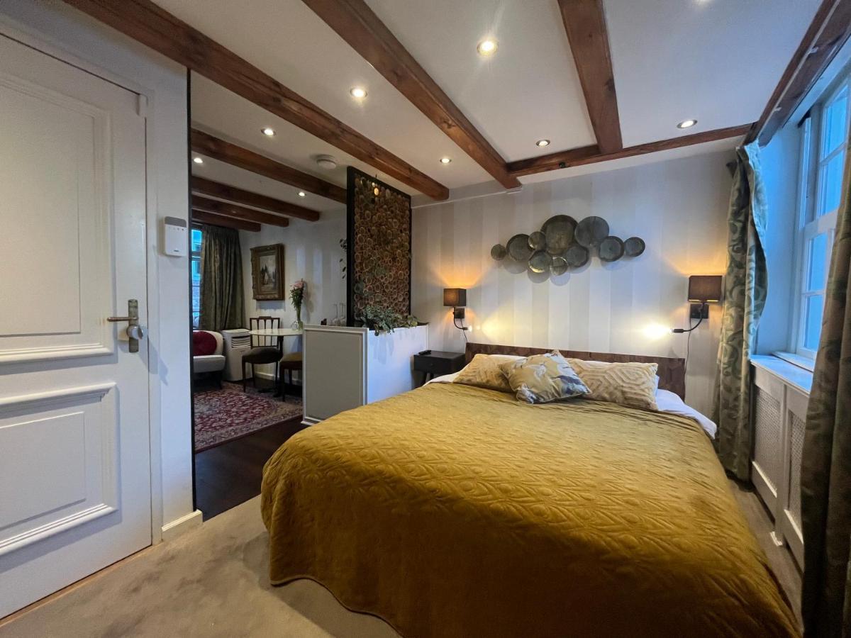 The Enlightened House Luxury Suites Amsterdam Bagian luar foto