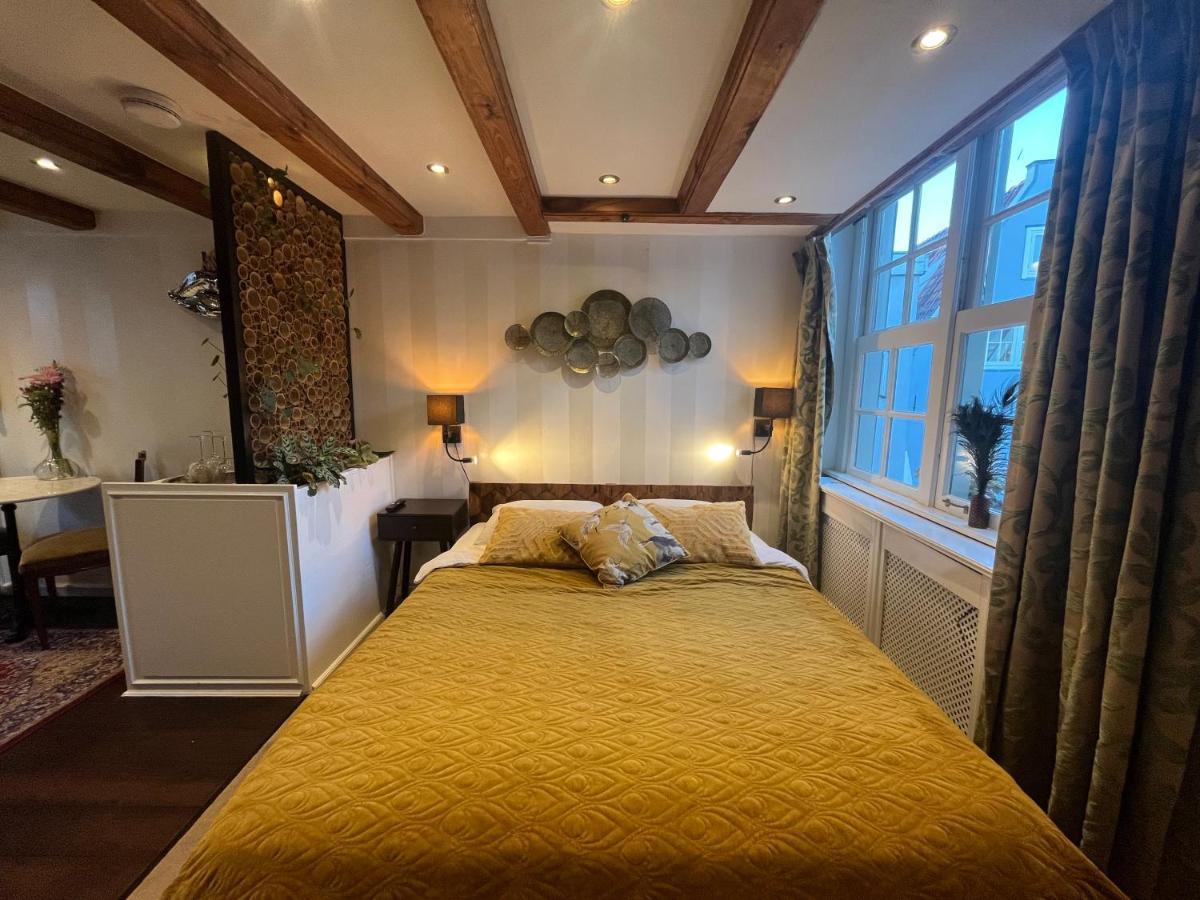 The Enlightened House Luxury Suites Amsterdam Bagian luar foto